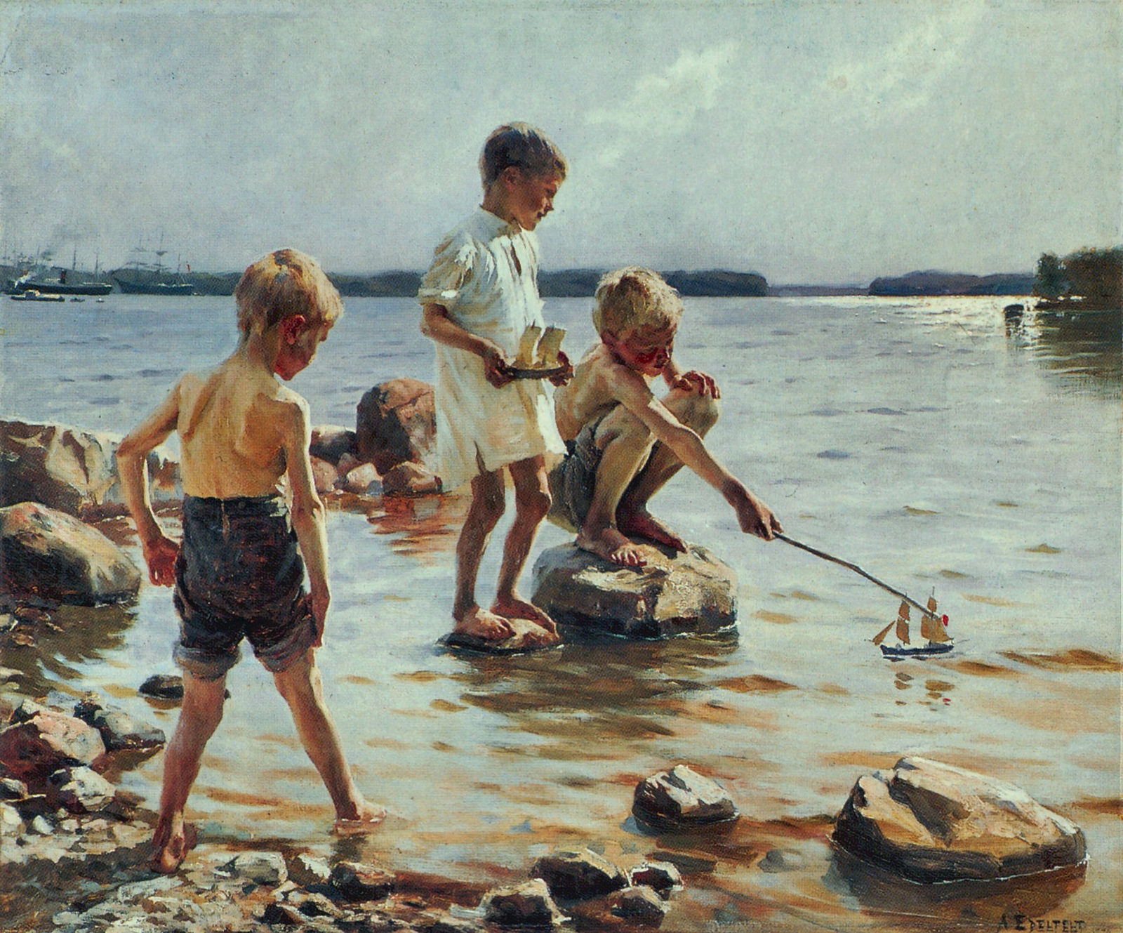 Leikkiviä poikia rannalla